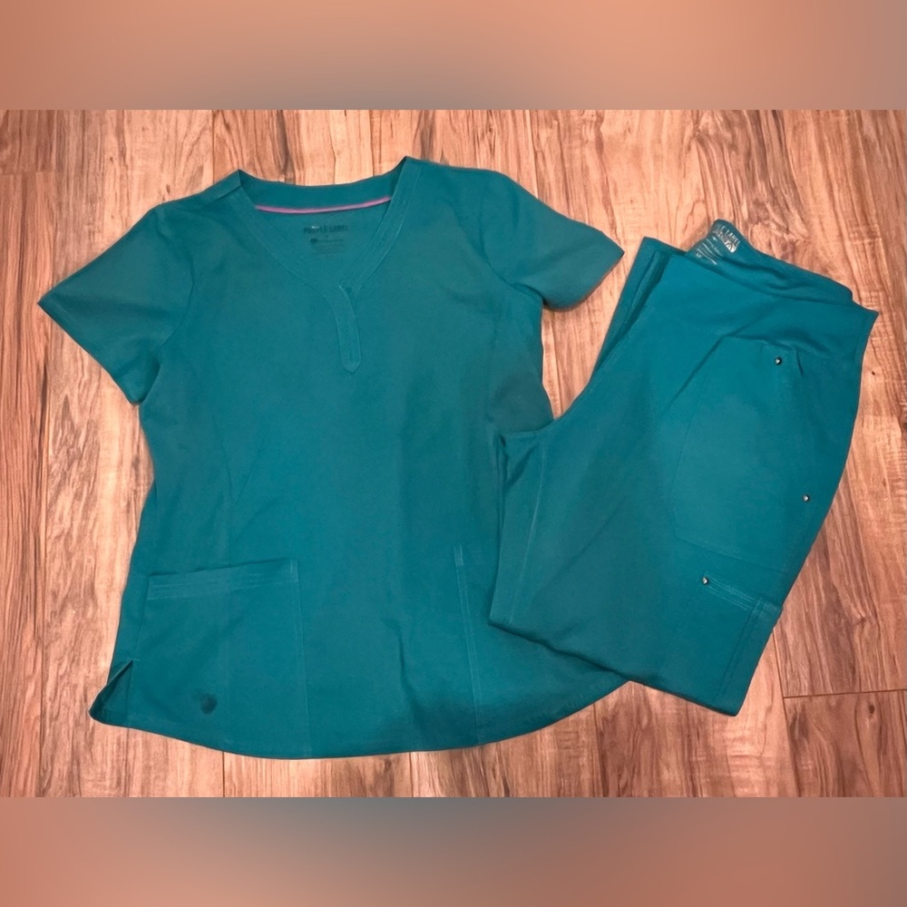 Women’s Healing Hands teal blue scrub set. Size M top and PL pants.